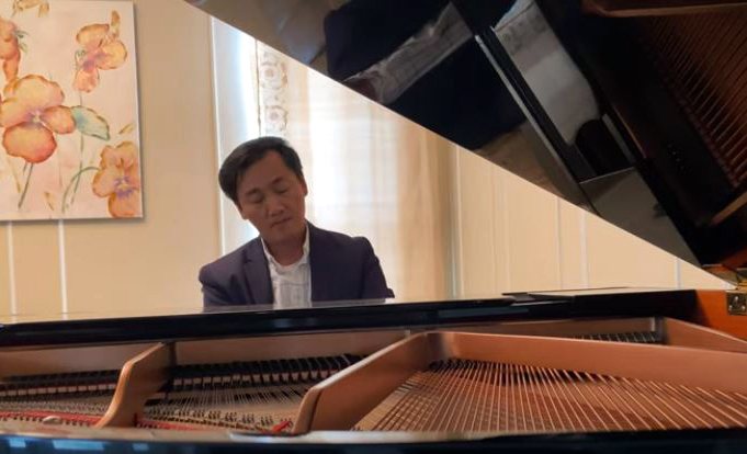 Thien playing a grand piano